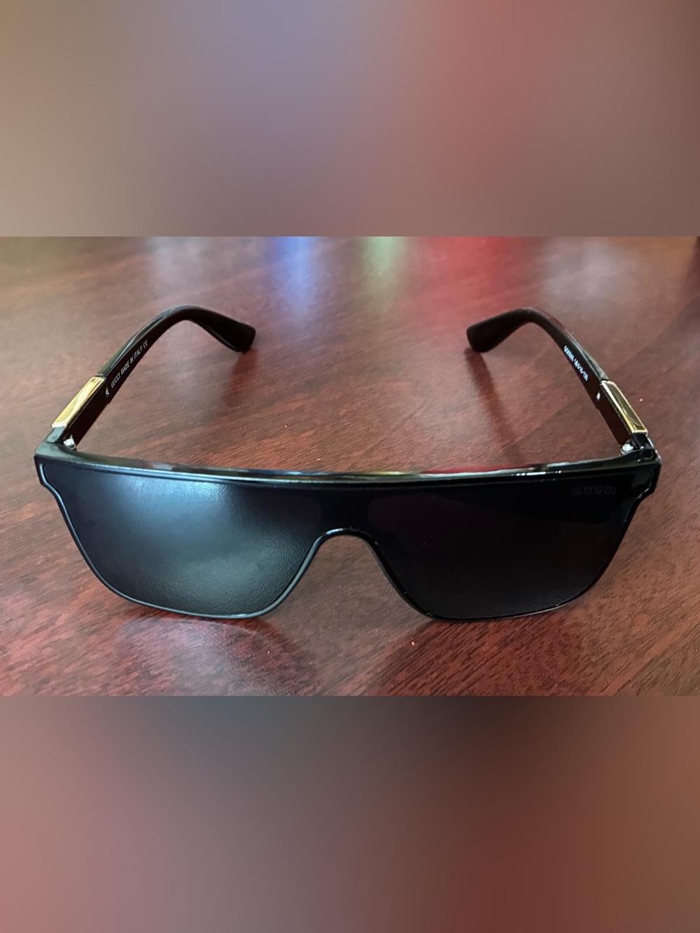 Gucci Men’s Black Shield Sunglasses with Gold Accents
